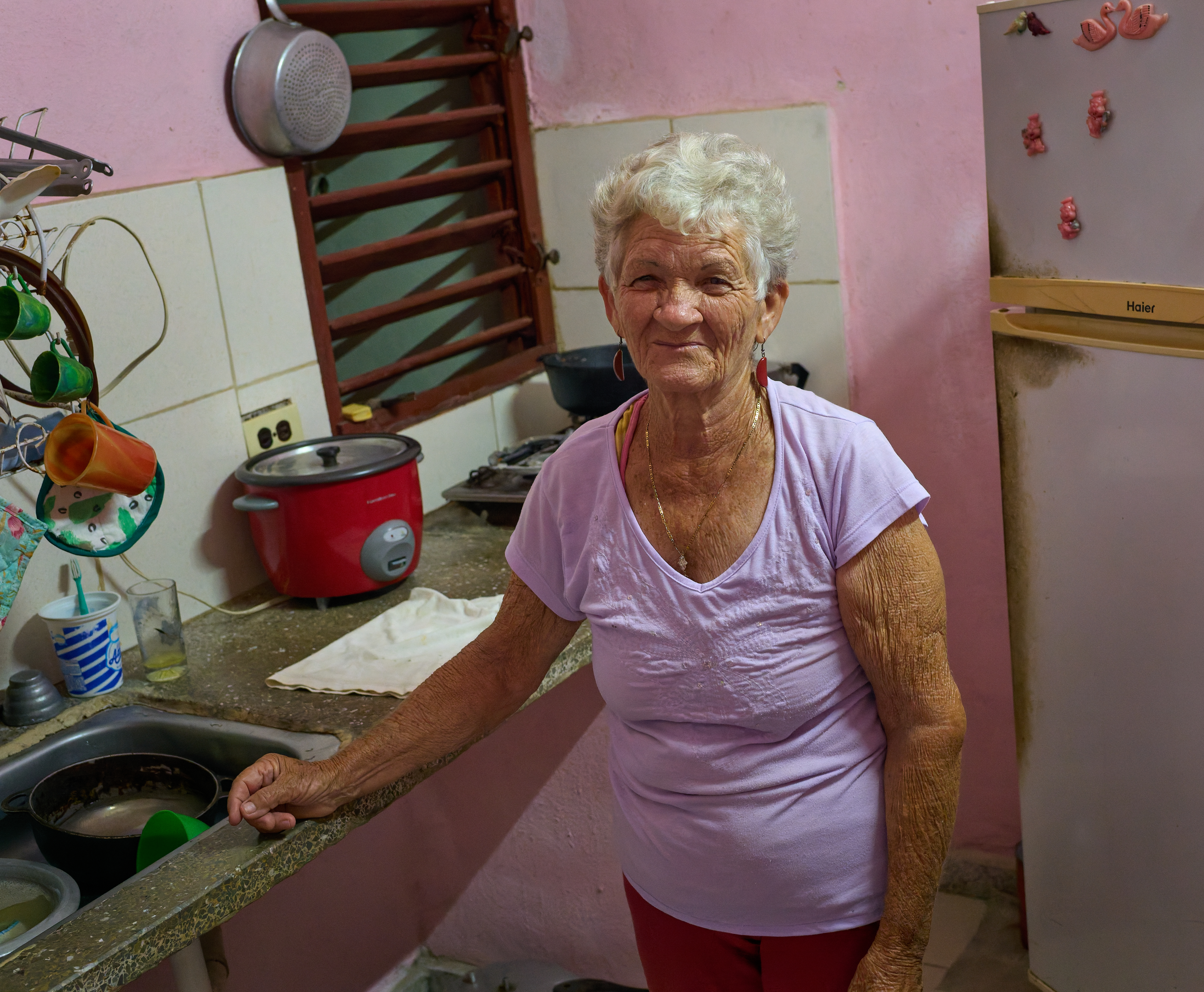 A Single Electric Pot:    With no gas delivery for six months, the couple now cooks all their meals using a single electric pot in their bare kitchen.