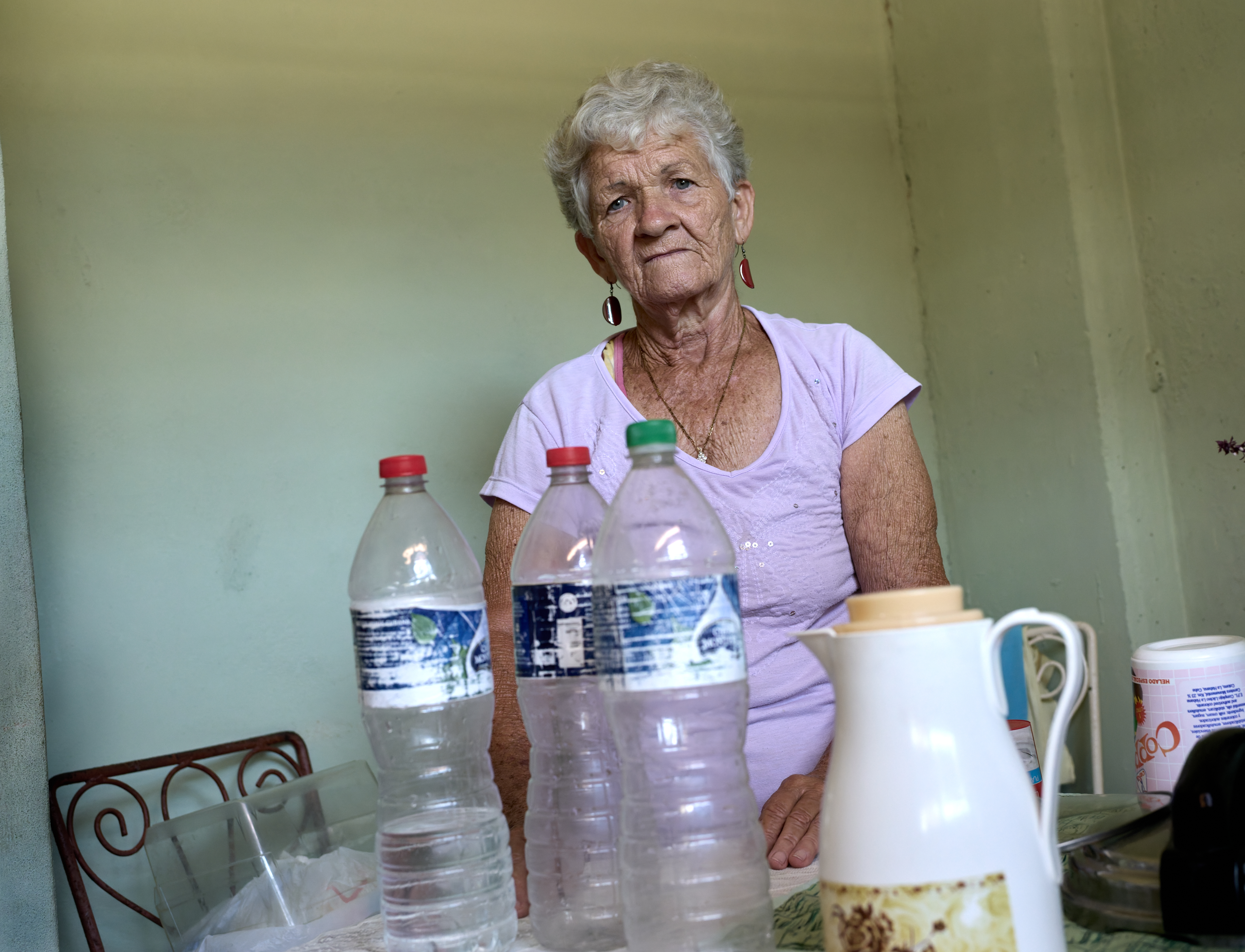 Boiling Water, One Bottle at a Time:    In Central Havana, Caridad and her husband boil all their water and store it in reused plastic bottles.  Off camera, more than a dozen full bottles line the wall . Like many Cubans, they don’t trust the tap. It’s a quiet ritual born of broken infrastructure.
