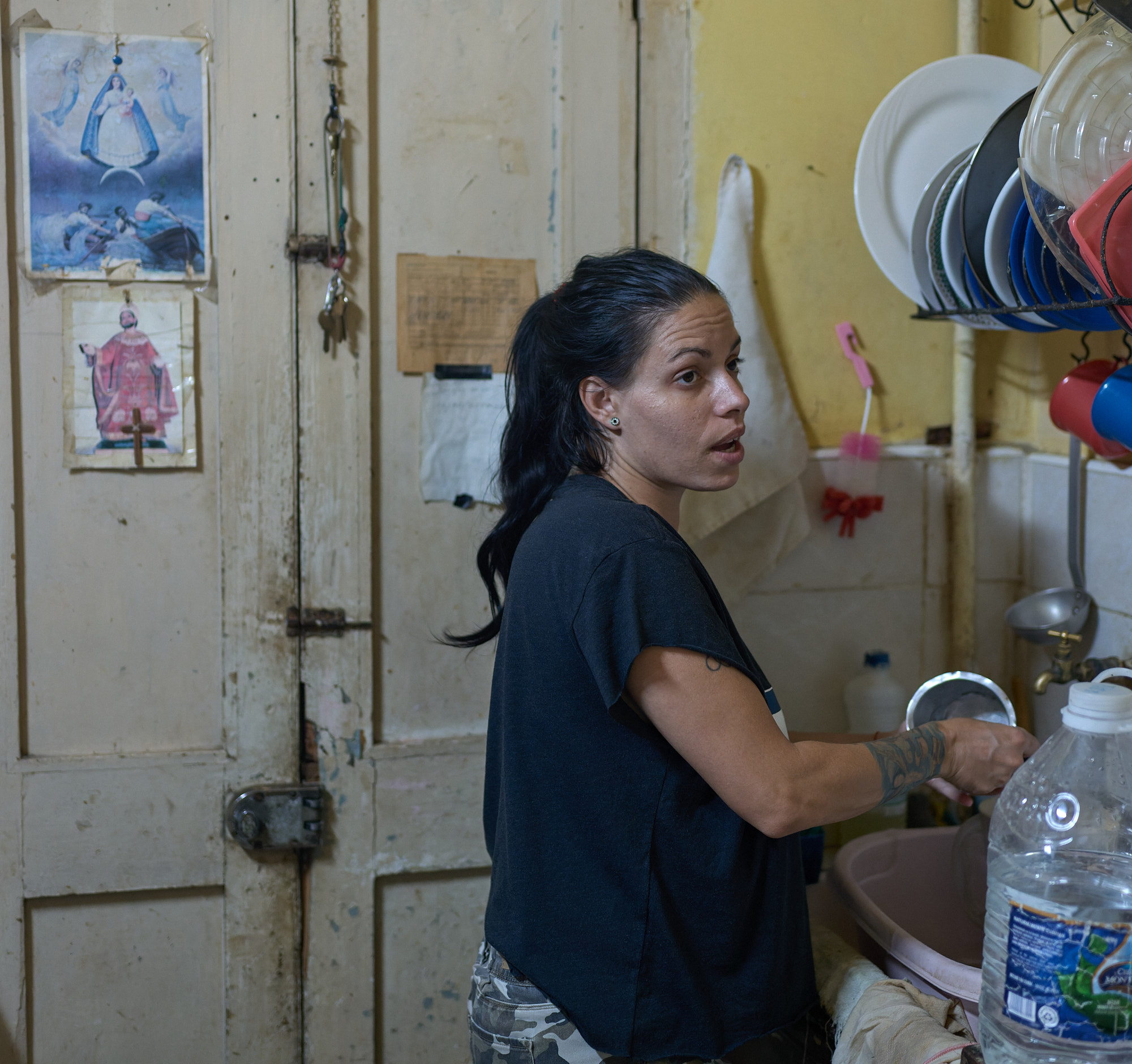 In the kitchen, Dori stands beside taped icons of La Virgen and a bishop — Yordanka’s faith, not hers. Dori is pragmatic and unsentimental: “Yordanka is better than any man,” she says. “So the kids have two moms.”